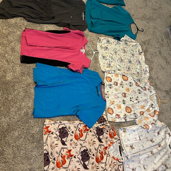 I have 6 scrub tops, one pair of scrub pants and 2 sets of scrubs. - Picture 2 of 3